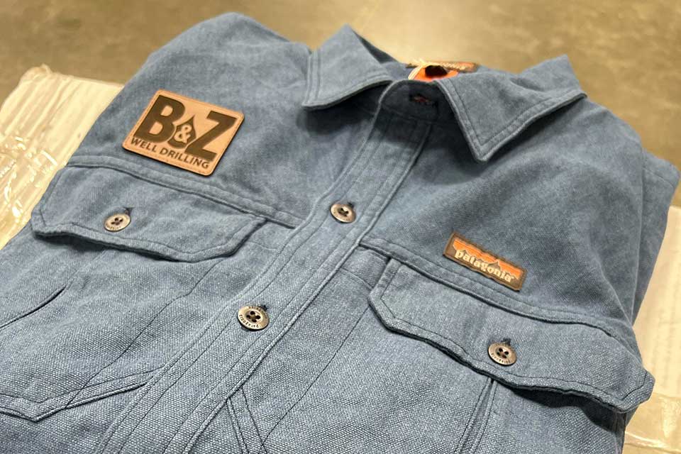 Patagonia button down shirt with a leather logo patch